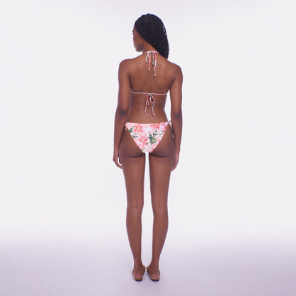 Person wearing a floral bikini on a white background