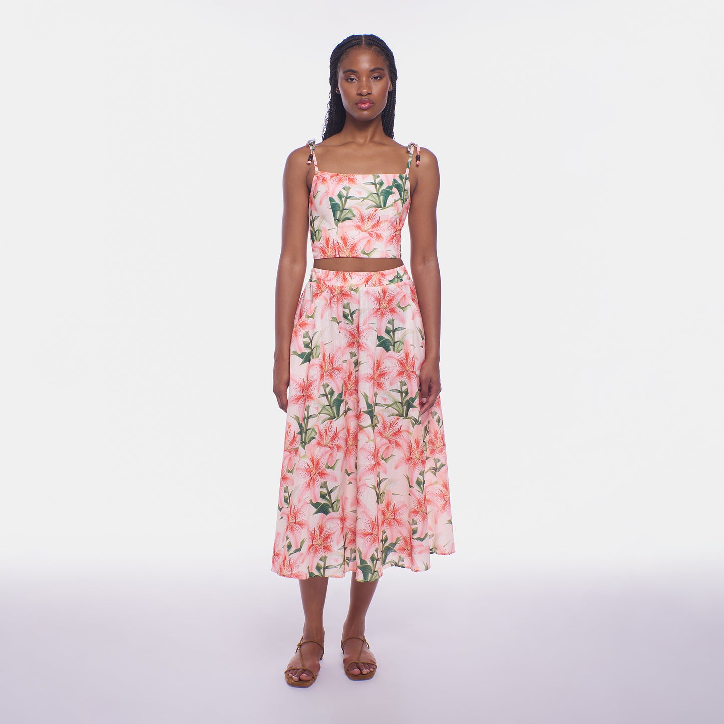 Woman wearing a floral dress on a white background