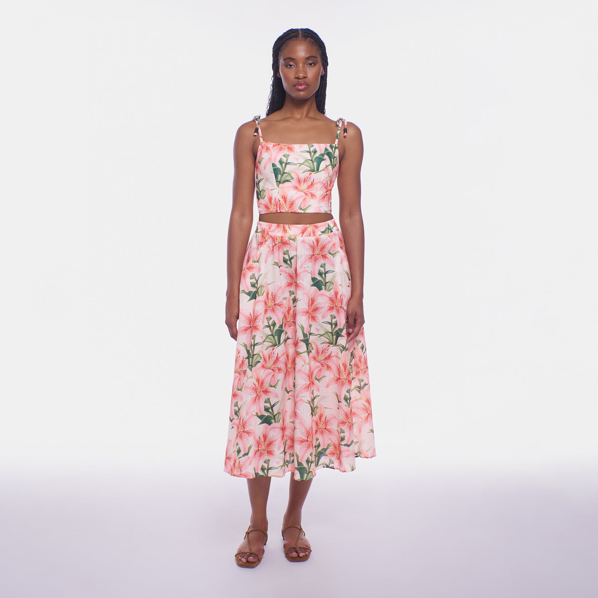 Woman wearing a floral dress on a white background