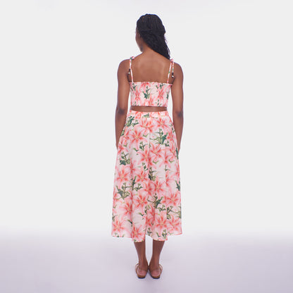 Woman wearing a floral dress on a white background