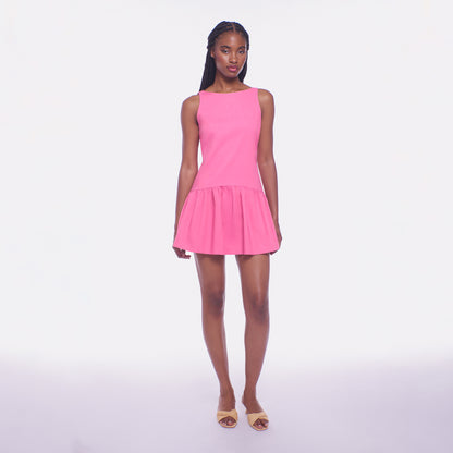 Woman wearing a pink dress on a white background